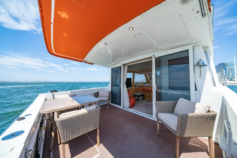 Altitude Adjustment Yacht Photos Pics Outdoor deck of 2000 Navigator 5300 Classic yacht with seating and ocean view.