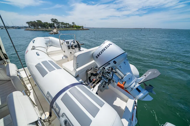 Altitude Adjustment Yacht Photos Pics Inflatable boat with Honda motor on Navigator 5300 Classic, 2000 model, near scenic coastline.