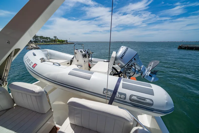 Altitude Adjustment Yacht Photos Pics Navigator 5300 Classic yacht with inflatable boat and Honda motor on deck, 2000 model.