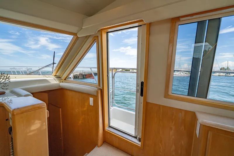 Altitude Adjustment Yacht Photos Pics Interior view of 2000 Navigator 5300 Classic yacht with open door to ocean.