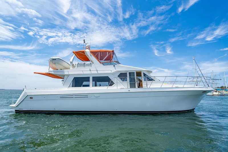 Altitude Adjustment Yacht Photos Pics 2000 Navigator 5300 Classic yacht on water under blue sky.
