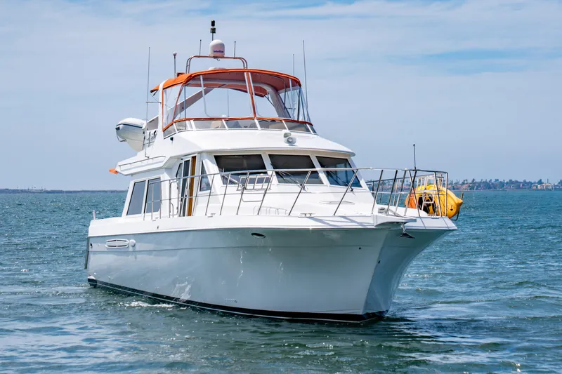 Altitude Adjustment Yacht Photos Pics 2000 Navigator 5300 Classic yacht cruising on open water under clear skies.