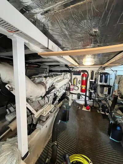 Our Time Yacht Photos Pics Engine room of 2001 Bayliner 5788 Pilot House Motoryacht, featuring mechanical components and equipment.