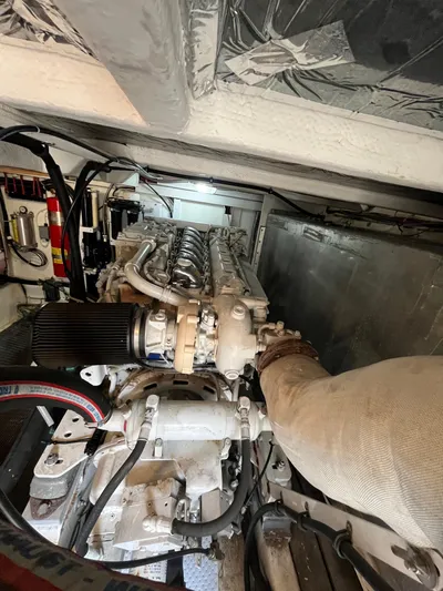 Our Time Yacht Photos Pics Engine room of 2001 Bayliner 5788 Pilot House Motoryacht, showcasing detailed machinery components.