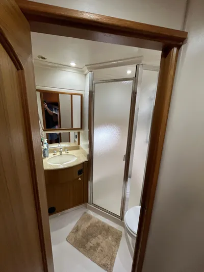 Our Time Yacht Photos Pics Bathroom interior of 2001 Bayliner 5788 Pilot House Motoryacht with shower and sink.