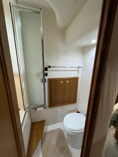 Our Time Yacht Photos Pics Bathroom interior of 2001 Bayliner 5788 Pilot House Motoryacht, featuring shower and toilet.