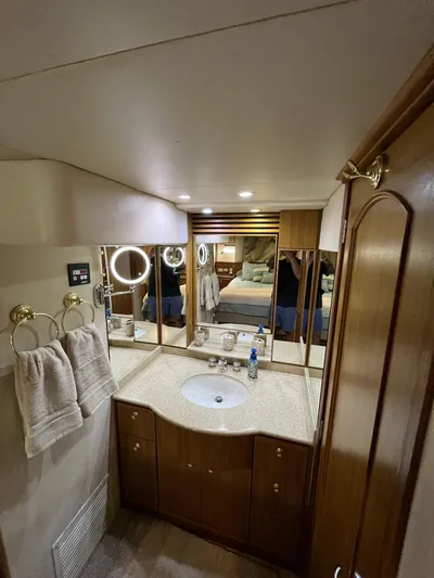 Our Time Yacht Photos Pics Luxurious bathroom in 2001 Bayliner 5788 Pilot House Motoryacht with elegant vanity and mirrors.