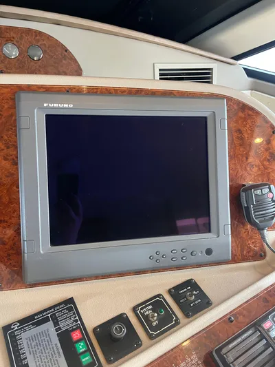 Our Time Yacht Photos Pics Control panel of 2001 Bayliner 5788 Pilot House Motoryacht with Furuno display and controls.
