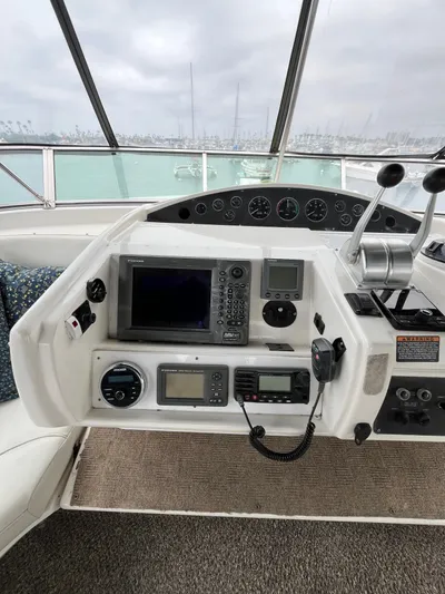 Our Time Yacht Photos Pics 2001 Bayliner 5788 Pilot House Motoryacht helm with navigation equipment and controls.
