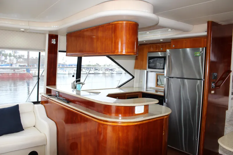 Our Time Yacht Photos Pics Luxurious kitchen interior of 2001 Bayliner 5788 Pilot House Motoryacht with modern appliances.