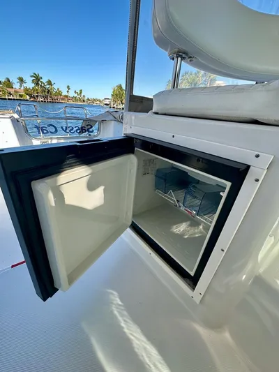 Sassy Cat Yacht Photos Pics Open refrigerator on 2009 Glacier Bay 3080 boat, with scenic waterfront view.