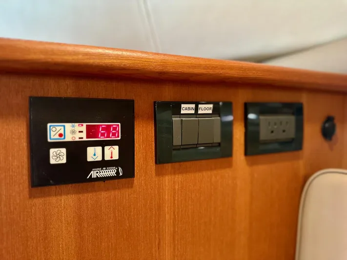 Sassy Cat Yacht Photos Pics Control panel on 2009 Glacier Bay 3080 boat, featuring temperature and cabin controls.