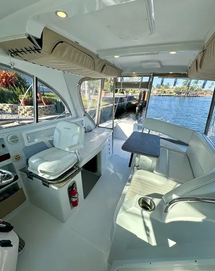 Sassy Cat Yacht Photos Pics 2009 Glacier Bay 3080 boat interior with seating, table, and water view.
