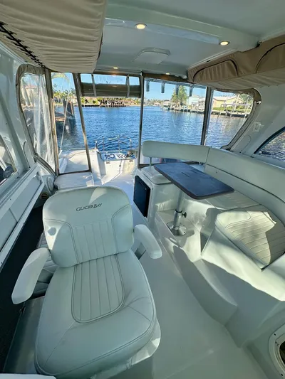 Sassy Cat Yacht Photos Pics Interior of a 2009 Glacier Bay 3080 boat with white seating and waterfront view.