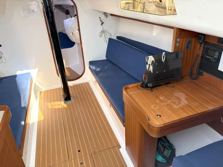 Ripple Yacht Photos Pics 2015 J Boats J 111 interior with blue seating and wooden flooring.
