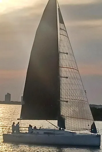 Ripple Yacht Photos Pics 2015 J Boats J 111 sailing at sunset with silhouetted crew.