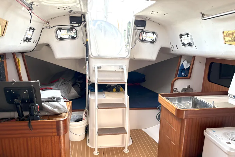 Ripple Yacht Photos Pics Interior of 2015 J Boats J 111 sailboat with wooden finishes and compact design.