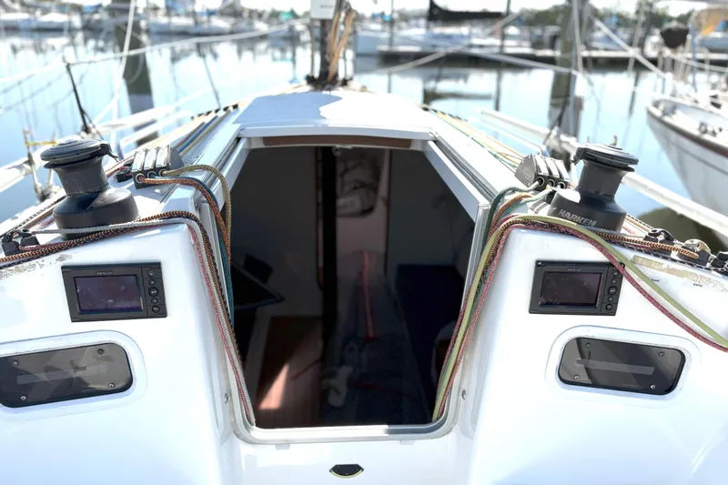 Ripple Yacht Photos Pics 2015 J Boats J 111 sailboat cockpit with open cabin, docked at marina.