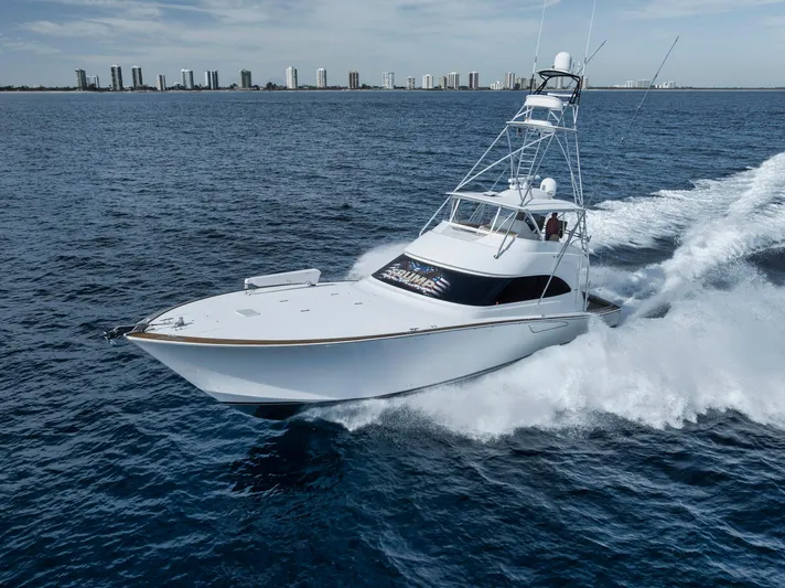 Life Is Good Yacht Photos Pics Viking 70 Convertible 2015 yacht cruising on open water near city skyline.