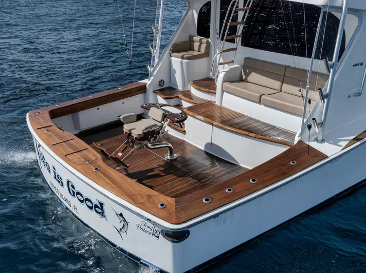 Life Is Good Yacht Photos Pics 2015 Viking 70 Convertible yacht with spacious deck and fishing chair on open water.