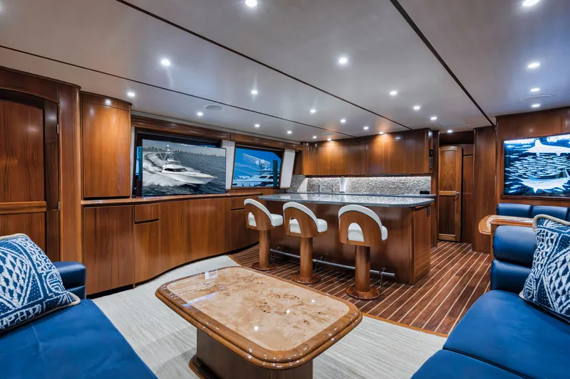 Life Is Good Yacht Photos Pics Luxurious interior of 2015 Viking 70 Convertible yacht with elegant wood finishes and modern seating.