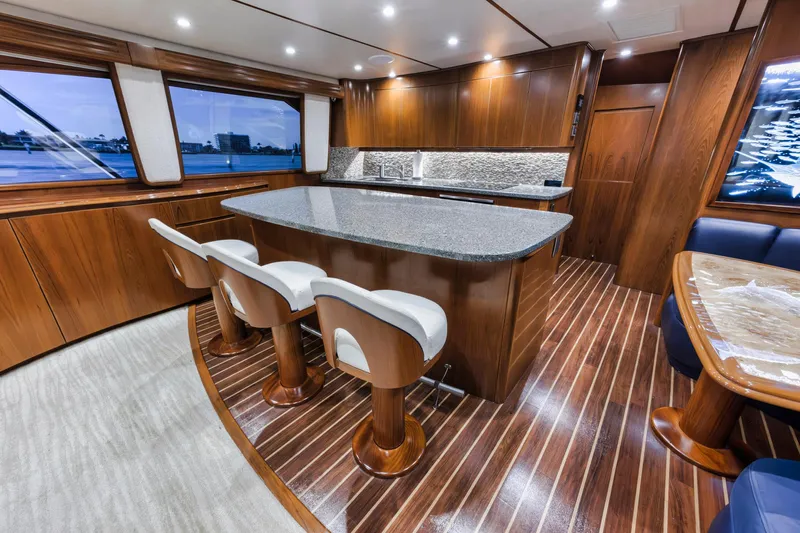 Life Is Good Yacht Photos Pics Luxurious interior of 2015 Viking 70 Convertible yacht with elegant wood finishes and modern design.