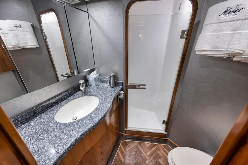Life Is Good Yacht Photos Pics Luxurious bathroom in 2015 Viking 70 Convertible yacht with modern fixtures and elegant design.