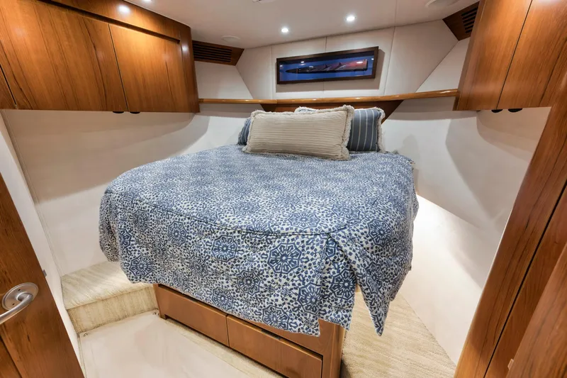Life Is Good Yacht Photos Pics Luxurious bedroom interior of 2015 Viking 70 Convertible yacht with cozy bedding.