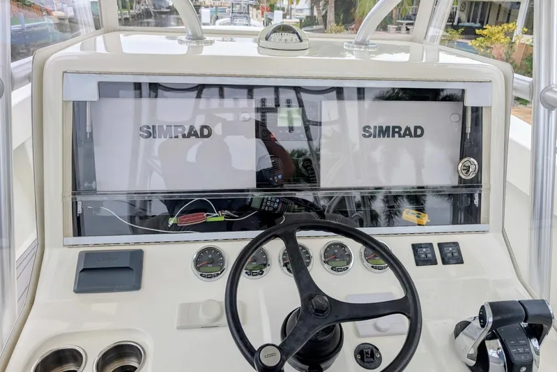 Hazard Pay Yacht Photos Pics 2017 SeaVee 390Z boat dashboard with Simrad displays and steering wheel.