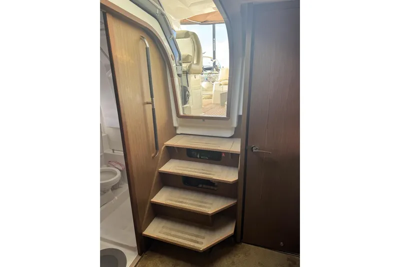 Lololand Yacht Photos Pics Interior stairs of 2018 Jeanneau Leader 36 yacht, leading to cockpit area.