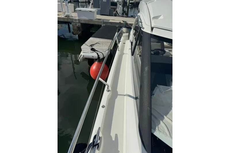 Lololand Yacht Photos Pics 2018 Jeanneau Leader 36 yacht docked with red buoy visible.