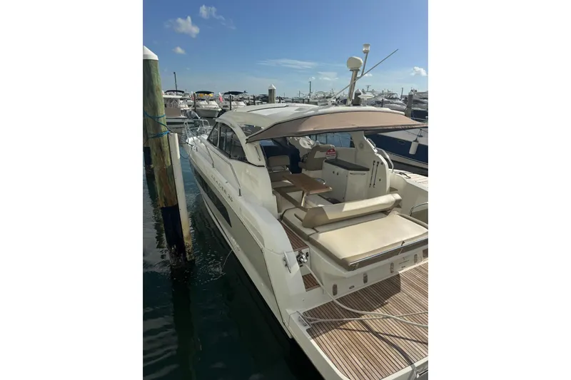 Lololand Yacht Photos Pics 2018 Jeanneau Leader 36 yacht docked at marina under clear blue sky.
