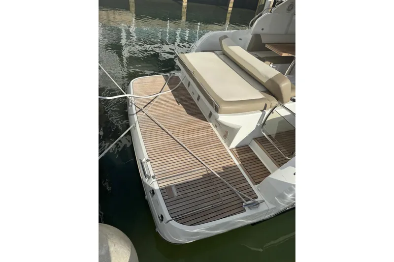 Lololand Yacht Photos Pics 2018 Jeanneau Leader 36 boat with teak deck and cushioned seating.