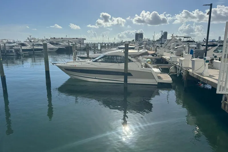 Lololand Yacht Photos Pics 2018 Jeanneau Leader 36 yacht docked at a marina under a sunny sky.