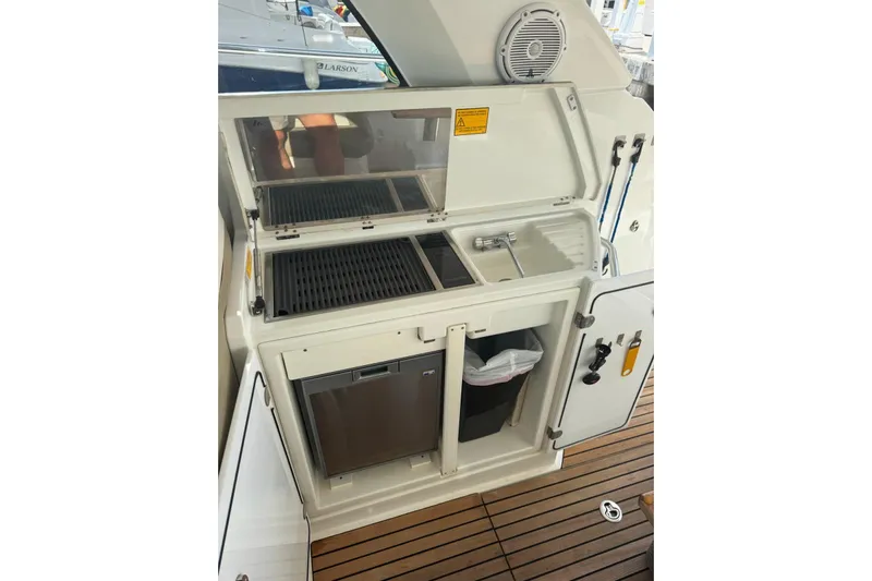 Lololand Yacht Photos Pics Outdoor kitchenette on 2018 Jeanneau Leader 36 yacht with grill and sink.