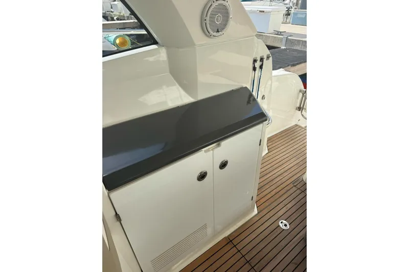 Lololand Yacht Photos Pics 2018 Jeanneau Leader 36 yacht interior with sleek cabinetry and teak flooring.