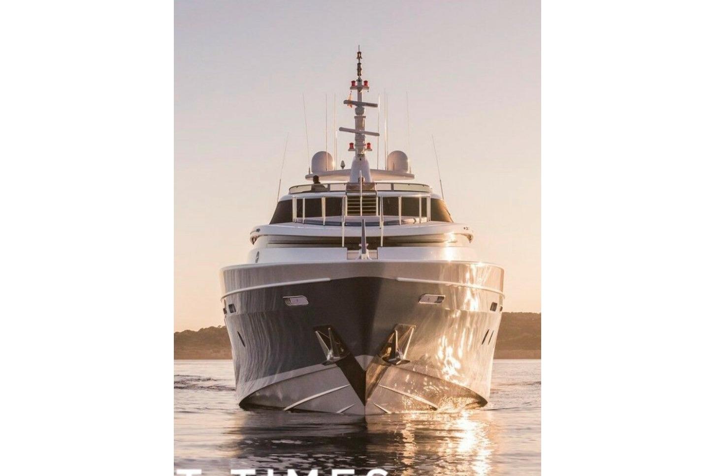 Luxury Evolution Yachts 34 Metre, 2007 model, cruising at sunset on calm waters.