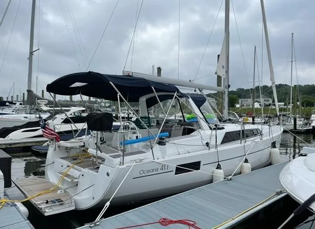  Yacht Photos Pics 2018 Beneteau Oceanis 41.1 sailboat docked at marina under cloudy skies.