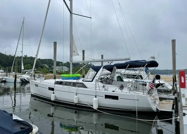  Yacht Photos Pics 2018 Beneteau Oceanis 41.1 sailboat docked in a marina, overcast sky.