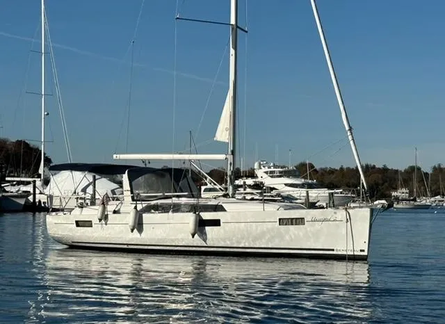  Yacht Photos Pics 2018 Beneteau Oceanis 41.1 sailboat on calm water, docked at marina.