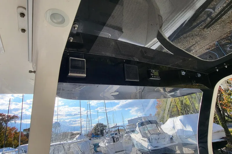  Yacht Photos Pics Interior view of a 2018 Edgewater 370CC boat with marina background.