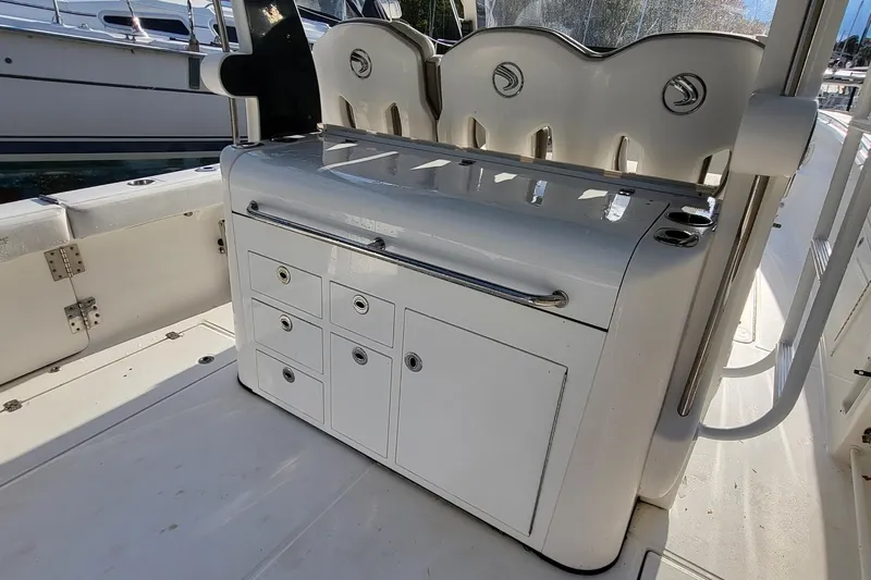  Yacht Photos Pics 2018 Edgewater 370CC boat interior with storage compartments and seating.