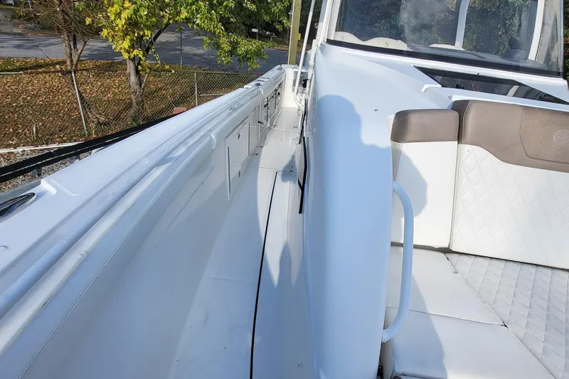  Yacht Photos Pics 2018 Edgewater 370CC boat interior with white seating and sleek design.