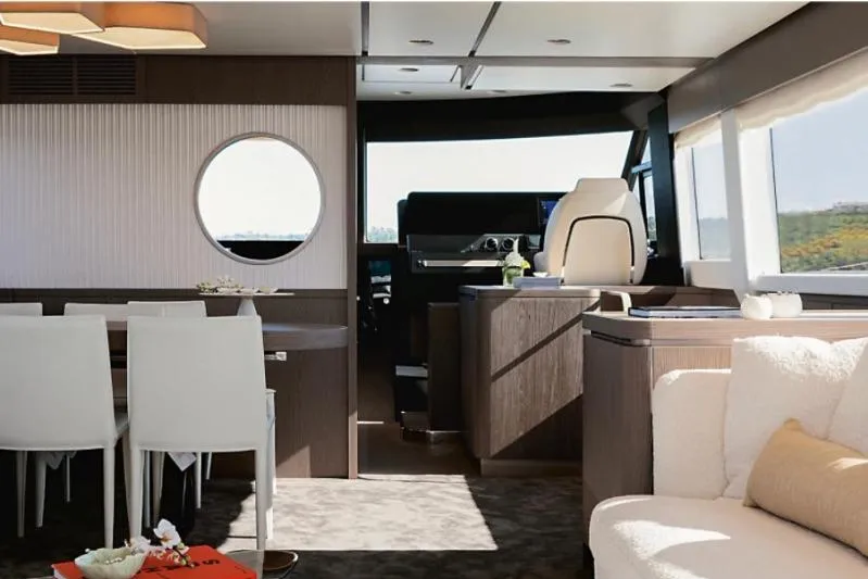 Azimut 66 Magellano Yacht Photos Pics Luxurious interior of 2021 Azimut Magellano 66 yacht, featuring elegant dining and helm areas.
