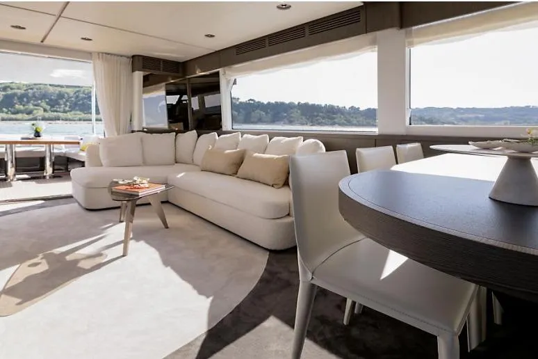 Azimut 66 Magellano Yacht Photos Pics Luxurious interior of 2021 Azimut Magellano 66 yacht with elegant seating and dining area.