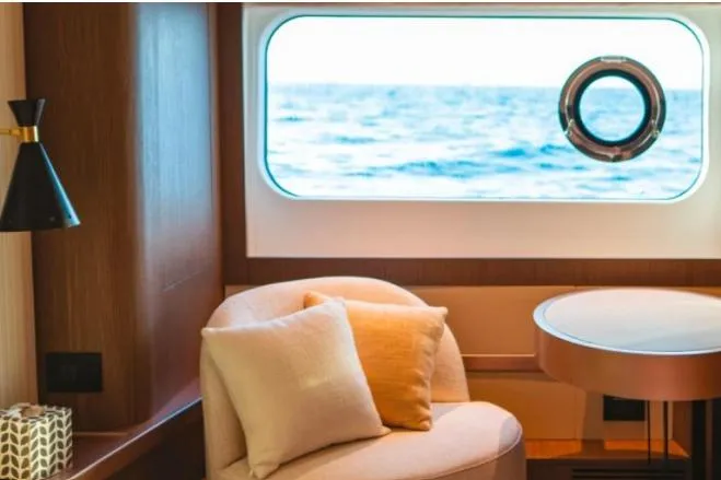 Azimut 66 Magellano Yacht Photos Pics Interior of 2021 Azimut Magellano 66 yacht with ocean view through window.