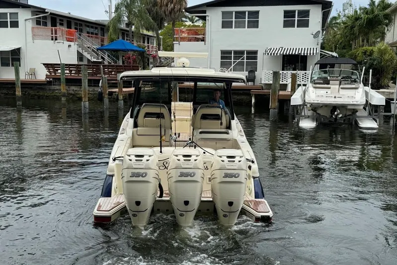  Yacht Photos Pics 2022 Chris-Craft Calypso 35 boat with triple 350 engines in a marina setting.