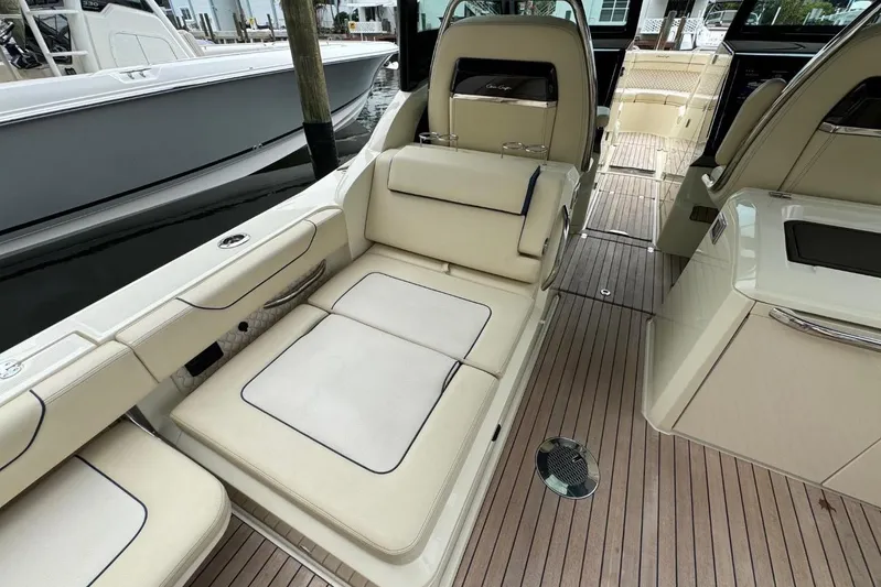  Yacht Photos Pics 2022 Chris-Craft Calypso 35 interior with beige seating and wooden deck.