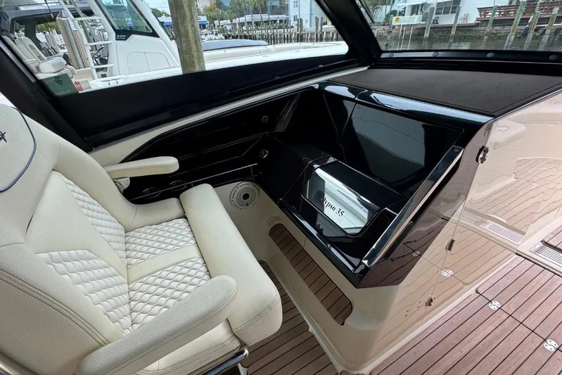  Yacht Photos Pics 2022 Chris-Craft Calypso 35 interior with luxurious seating and sleek dashboard design.