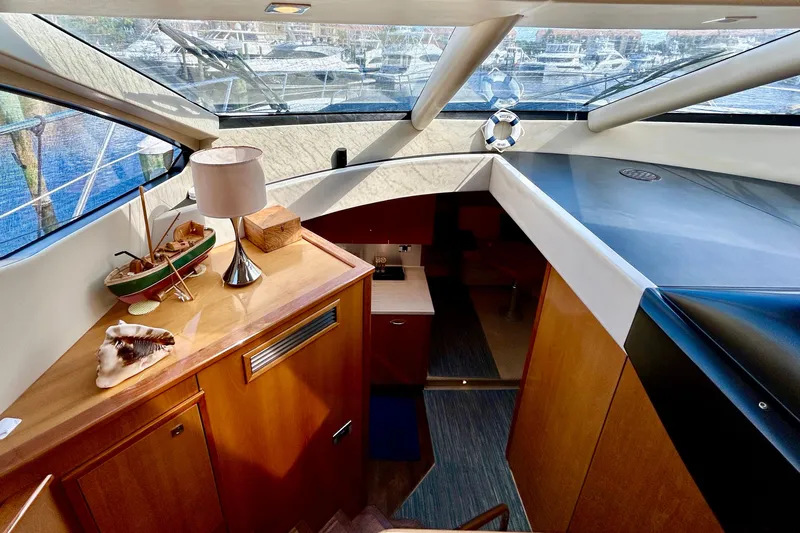 Casa Sul Mare Yacht Photos Pics Interior of 2010 Sunseeker Predator 64 yacht with elegant wood finish and nautical decor.